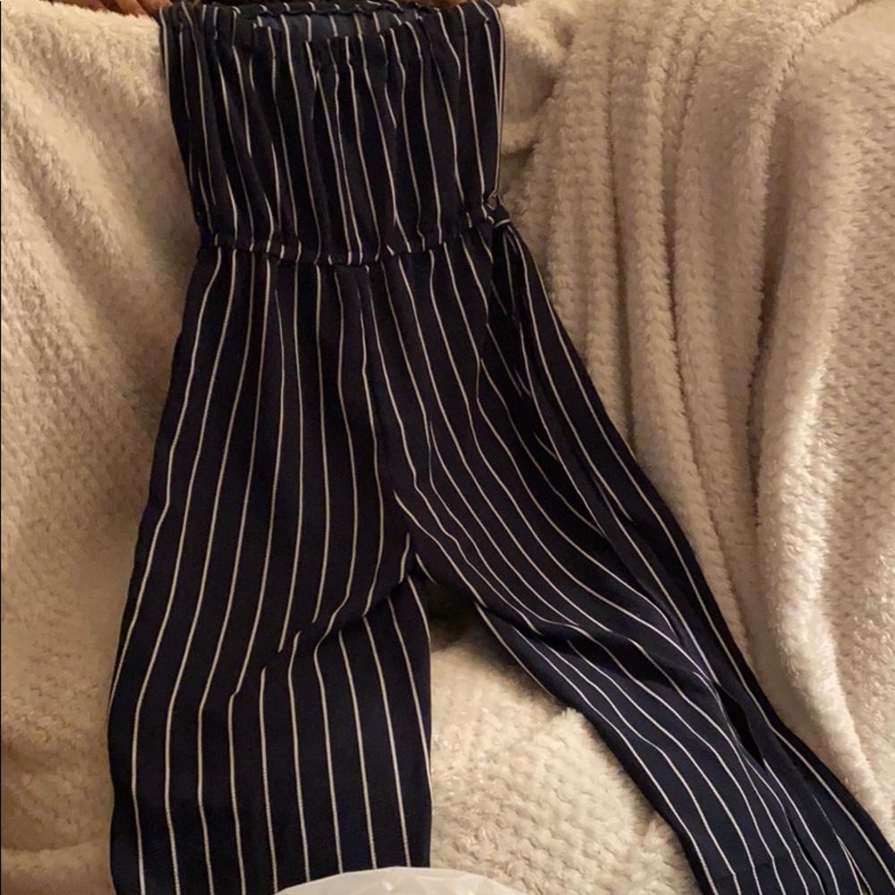 Dark blue and white striped jumper. Medium size
